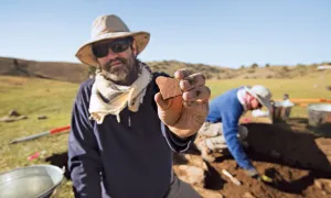 michael frachetti holds ceramic shard 